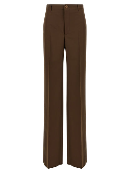 Trousers by Gucci for women in polyester brown presents a smart silhouette, meticulously detailed with a smart straight-leg & wide, a smart long, and a smart mid rise.