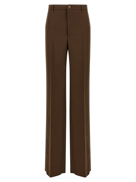 Trousers by Gucci for women in polyester brown presents a smart silhouette, meticulously detailed with a smart straight-leg & wide, a smart long, and a smart mid rise.