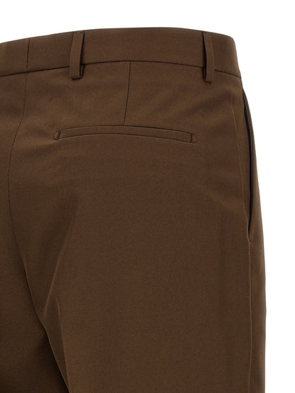 Trousers by Gucci for women in polyester brown features an sartorial silhouette, showcasing a precise straight-leg & wide and long with a sartorial mid rise for a refined look.