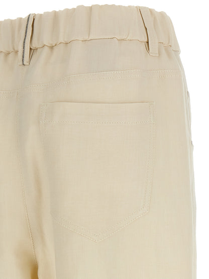 Casual Pants by Brunello Cucinelli for women in linen & viscose white & signature presents a tailored silhouette, showcasing a tailored and long cut with a refined for a truly tailored aesthetic.