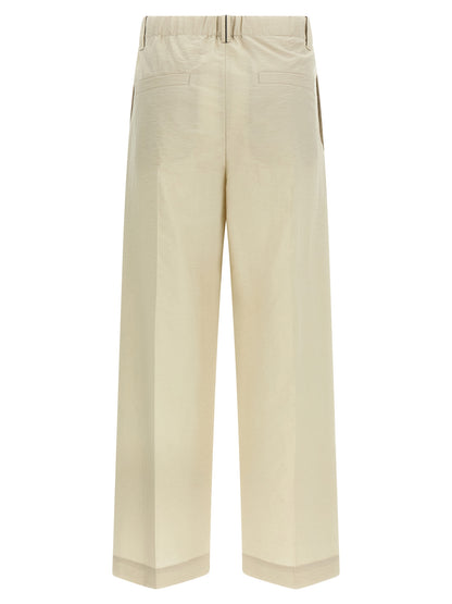 Trousers by Brunello Cucinelli for women in polyamide cotton white presents a smart silhouette, meticulously detailed with a smart , a smart long, and a smart mid rise.