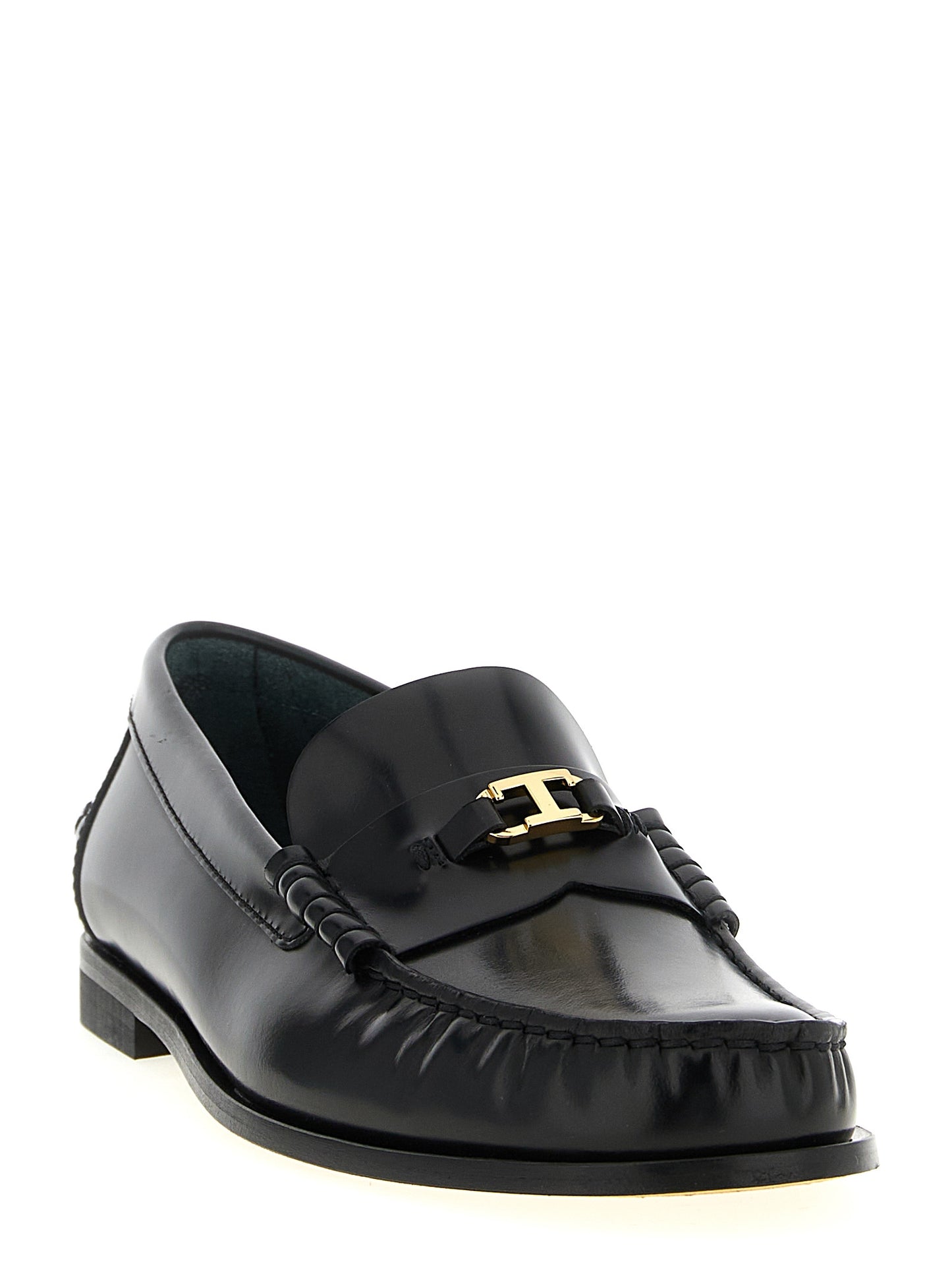 Flat Loafer Slip-On Shoes by Tod's for women in calfskin leather black & gold showcases a resplendent T Timeless Women's Calfskin Leather Flat Loafer Slip-On Shoes aesthetic, defined by its resplendent and elegant flat.