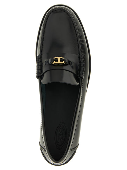 Flat Loafer Slip-On Shoes by Tod's for women in calfskin leather black & gold showcases a timeless silhouette from the T Timeless Women's Calfskin Leather Flat Loafer Slip-On Shoes collection, featuring a timeless flat and for a timeless finish.