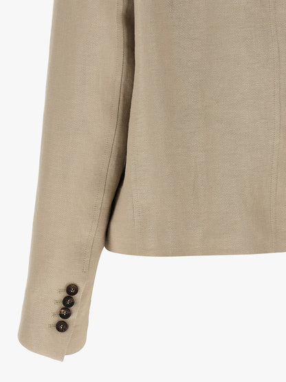 This Blazer by Brunello Cucinelli for women in linen & denim beige presents a tailored silhouette, meticulously tailored with a tailored and distinctive for a tailored finish.