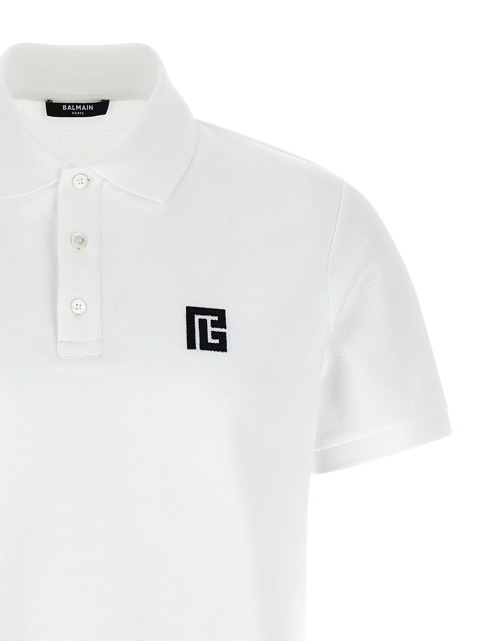 Polo Shirt by Balmain for men in cotton bicolour, black & white presents a distinguished silhouette, showcasing a sophisticated and distinguished for a truly distinguished finish.