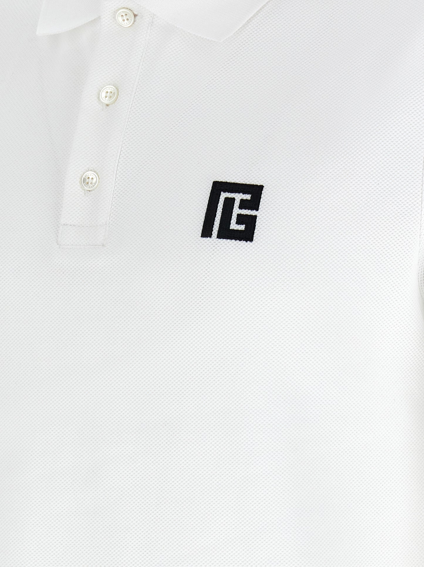 This Polo Shirt by Balmain for men in cotton bicolour, black & white presents a flawless silhouette, showcasing flawless detailing and a refined for a truly flawless aesthetic.