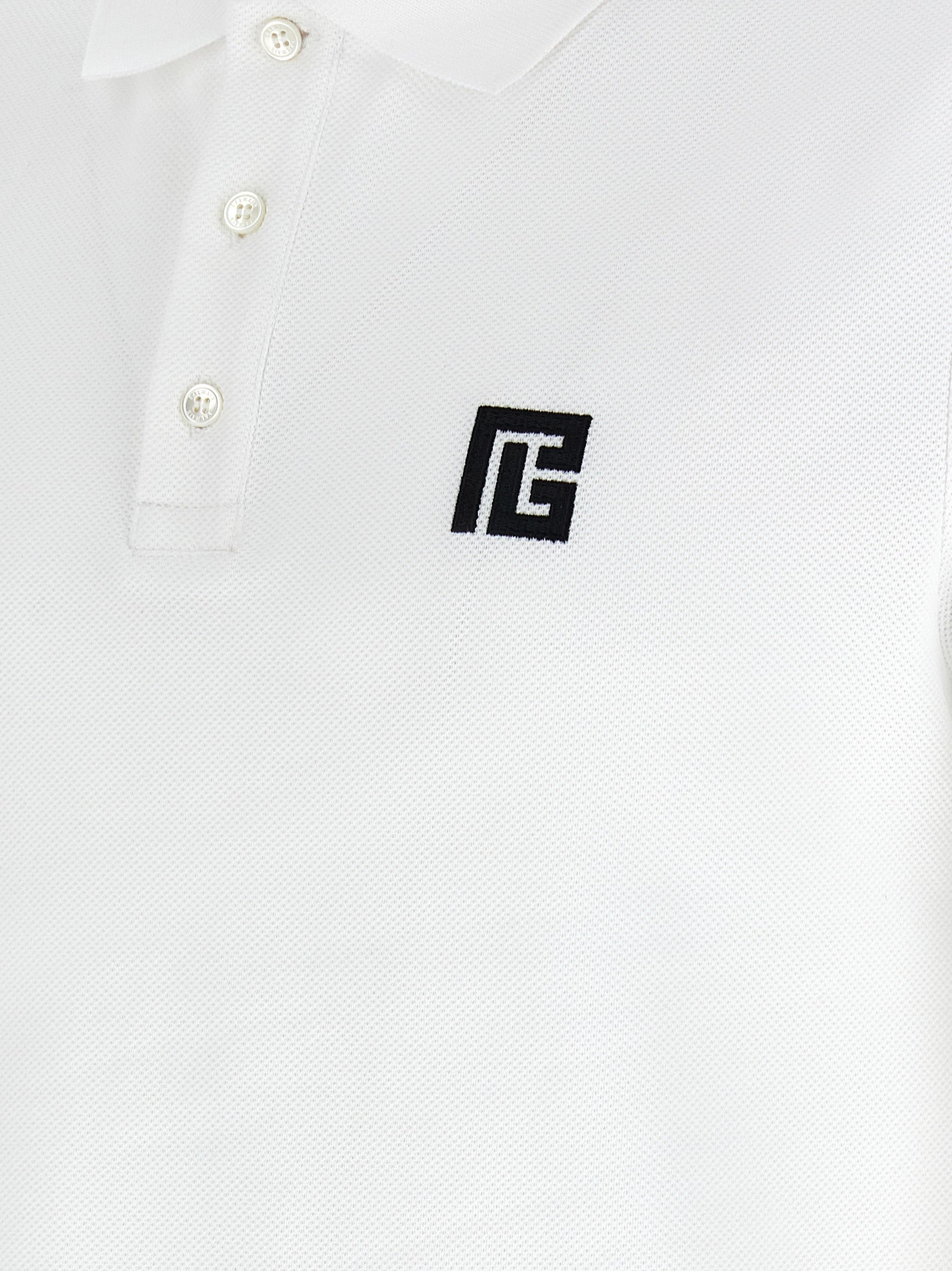 This Polo Shirt by Balmain for men in cotton bicolour, black & white presents a flawless silhouette, showcasing flawless detailing and a refined for a truly flawless aesthetic.