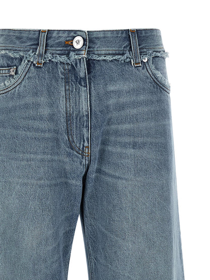 Jeans by Versace for women in cotton denim blue & signature features a polished silhouette with a polished relaxed-fit, wide & boyfriend, reaching a polished long and finished with a polished low rise.