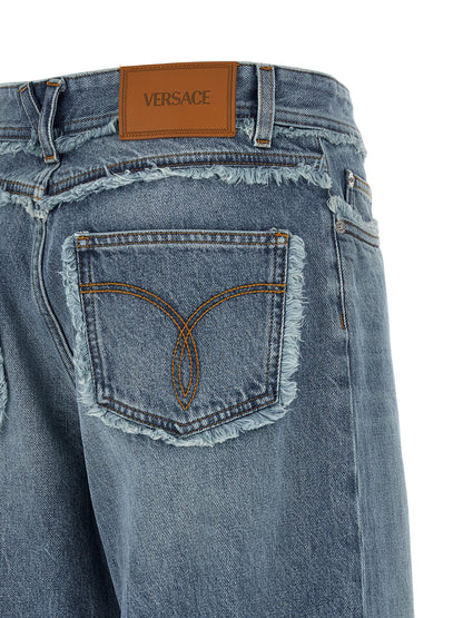 Jeans by Versace for women in cotton denim blue & signature features an sartorial relaxed-fit, wide & boyfriend and long with a low rise cut for a sartorial finish.