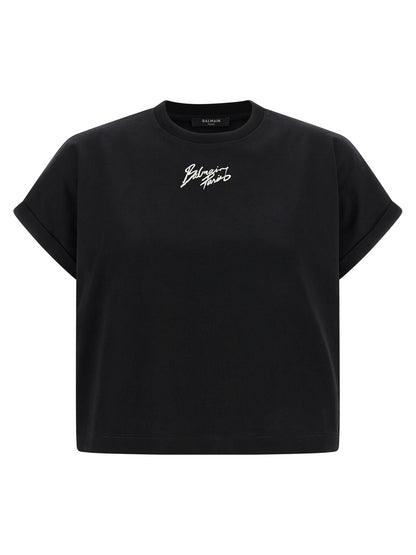 T-Shirt by Balmain for women in cotton black & print showcases a unassuming silhouette, artfully detailed with a refined and unassuming short-sleeve for a sophisticated, contemporary look.
