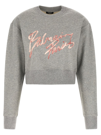 Activewear Sweatshirt by Balmain for women in cotton gray & print features an streamlined silhouette, showcasing the streamlined crew neckline and long-sleeve with functional for a premium, athletic look.