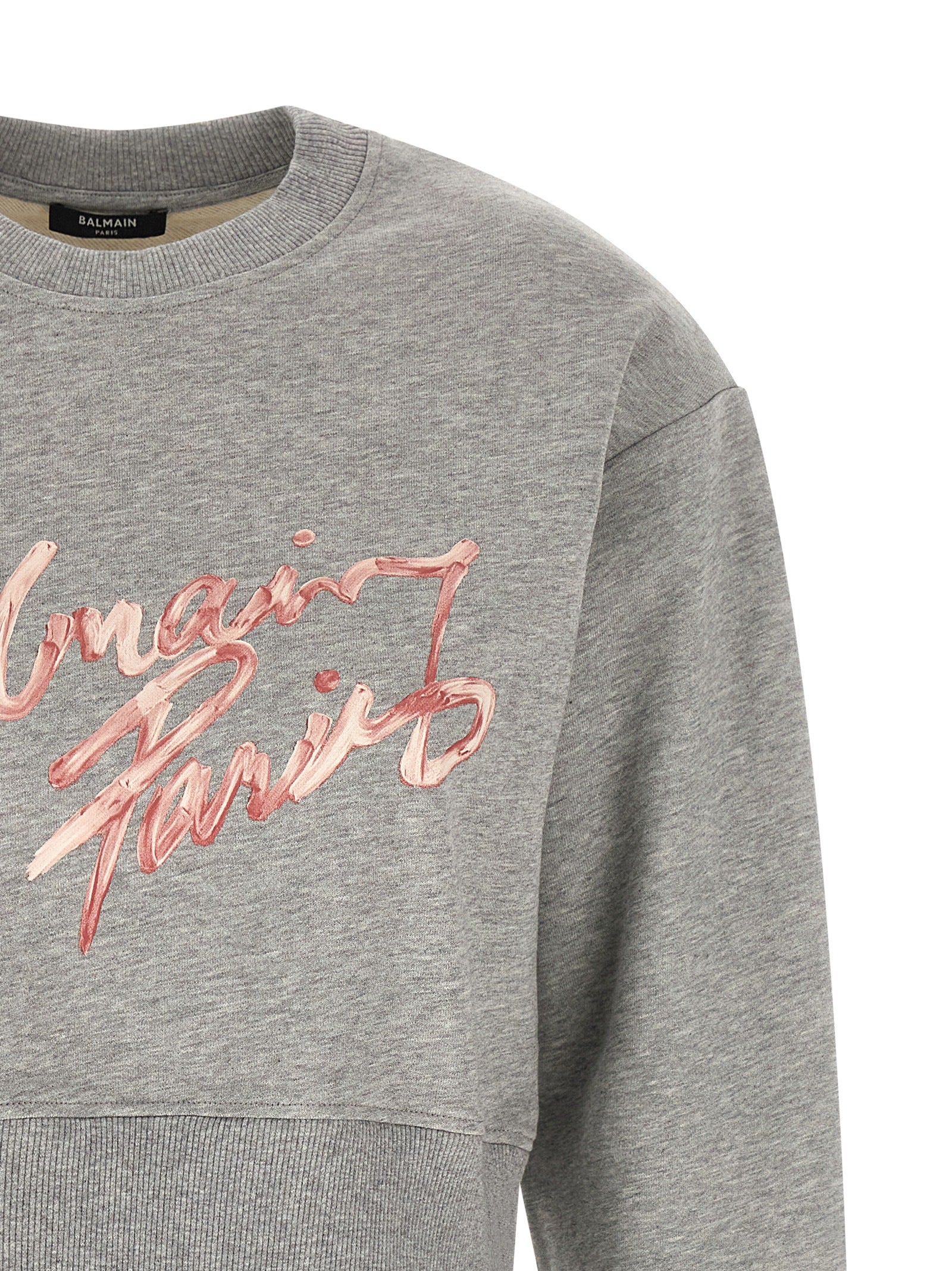 Activewear Sweatshirt by Balmain for women in cotton gray & print presents a dynamic silhouette, featuring a dynamic crew neckline and detailed with functional .