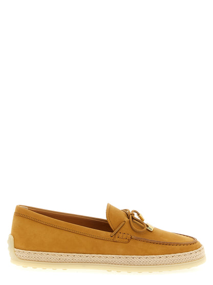 Flat Loafer Slip-On Shoes by Tod's for women in raffia & suede calfskin leather beige showcases a resplendent Women's Raffia & Suede Calfskin Leather Flat Loafer Slip-On Shoes aesthetic, defined by its resplendent and elegant flat.