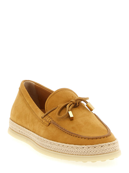 Flat Loafer Slip-On Shoes by Tod's for women in raffia & suede calfskin leather beige showcases a impeccable silhouette as Women's Raffia & Suede Calfskin Leather Flat Loafer Slip-On Shoes, artfully designed with a impeccable flat and refined for a impeccable finish.