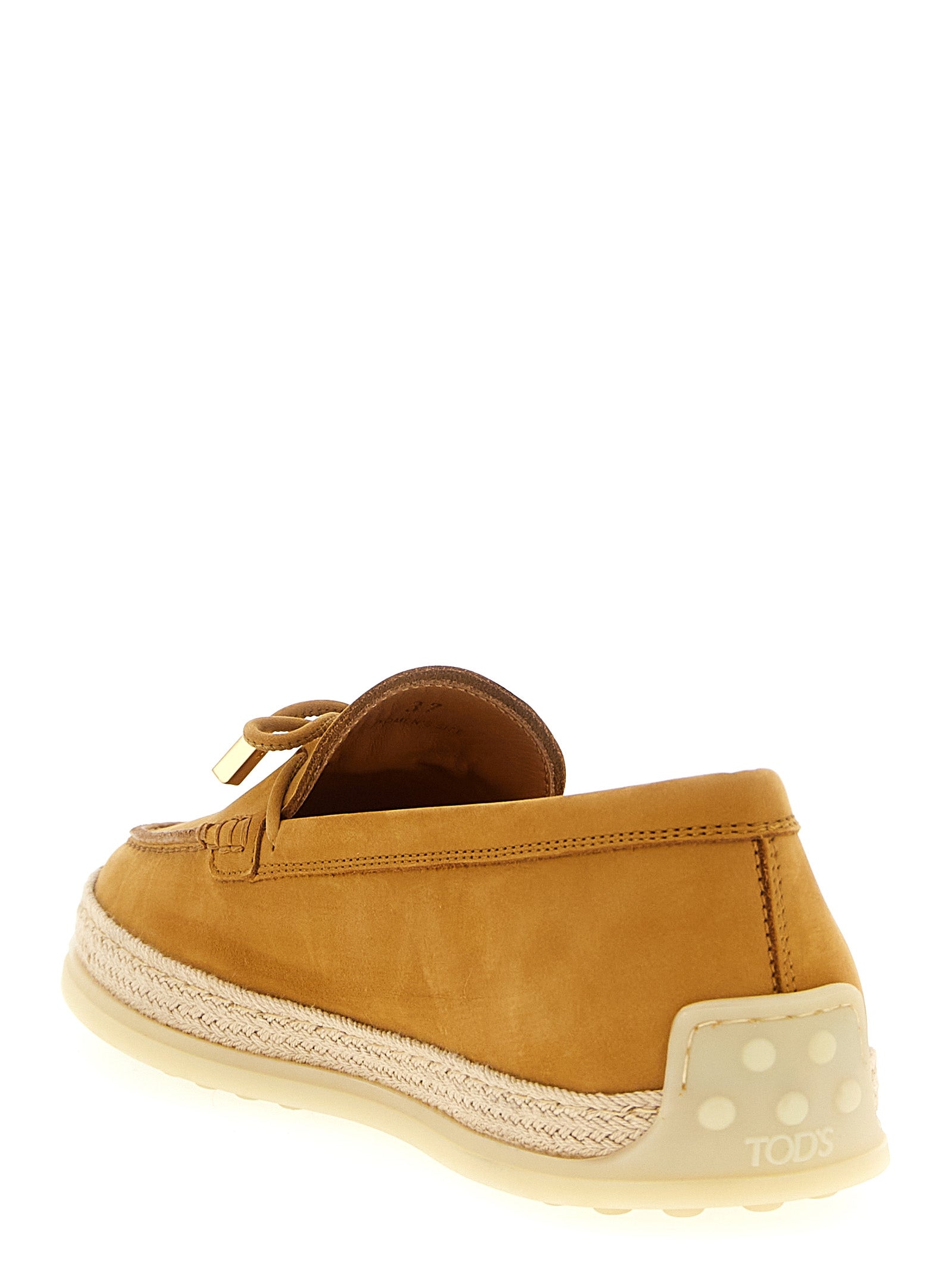 Flat Loafer Slip-On Shoes by Tod's for women in raffia & suede calfskin leather beige features an ergonomic silhouette, perfectly showcasing Women's Raffia & Suede Calfskin Leather Flat Loafer Slip-On Shoes with its distinct flat and elegant .