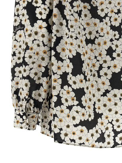 Blouse by Valentino Garavani for women in silk crepe bicolour, black, white & patterned showcases a sublime silhouette, artfully detailed with a sublime and for a sophisticated, sublime finish.
