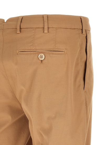 Trousers by Brunello Cucinelli for men in stretch cotton beige features an sartorial silhouette, showcasing a precise and long with a sartorial for a refined look.