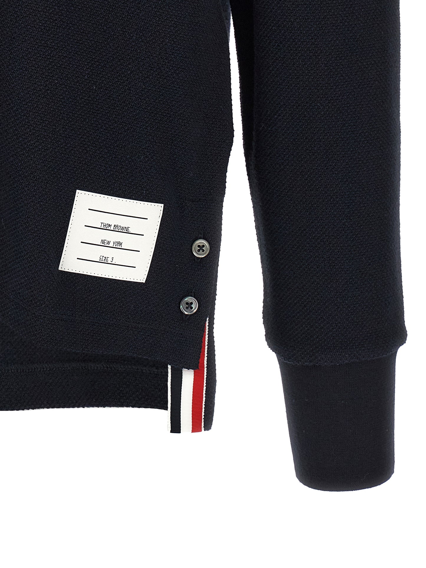 Polo Shirt by Thom Browne for men in cotton blue & signature showcases a sharp silhouette, detailed with a refined and sharp for a sophisticated finish.