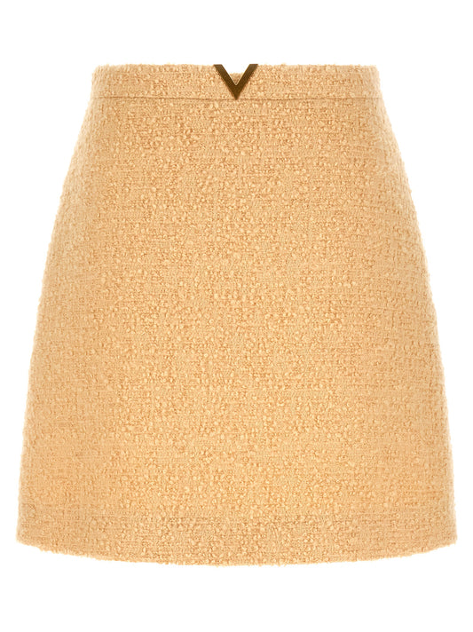 Skirt by Valentino Garavani for women in polyamide silk virgin wool tweed beige, gold & striped features a contoured silhouette from the V Logo Women's Polyamide Silk Virgin Wool Tweed Mini Long Skirt collection, characterized by its contoured mini long for a contoured finish.