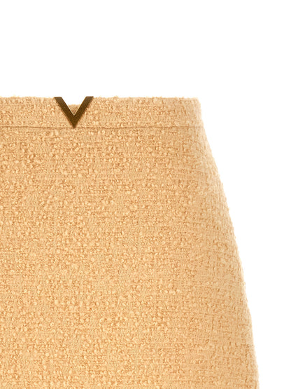 Skirt by Valentino Garavani for women in polyamide silk virgin wool tweed beige, gold & striped features an tailored silhouette, artfully capturing the essence of V Logo Women's Polyamide Silk Virgin Wool Tweed Mini Long Skirt in a sophisticated mini long.