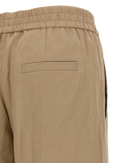 Casual Pants by Brunello Cucinelli for women in cotton & silk beige features an refined tailoring silhouette, showcasing a premium wide with a and long cut for a refined tailoring look.