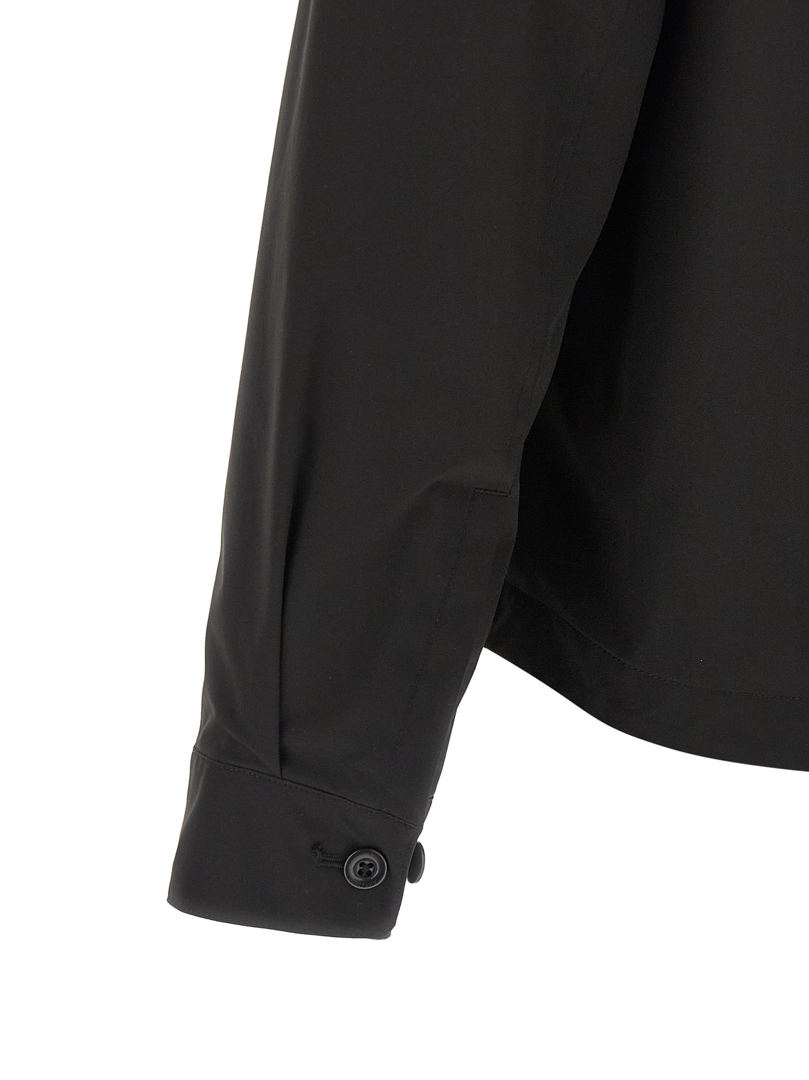 Overshirt by C.P. Company for men in polyester black showcases a sharp silhouette, elegantly detailed with a sharp and sharp .