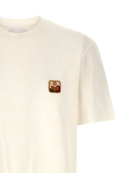 T-Shirt by Isabel Marant for men in denim cotton white showcases a dramatic silhouette, elegantly detailed with a dramatic and for a truly dramatic finish.