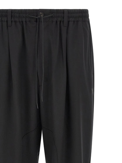 Casual Pants by Y-3 for men in polyester & wool black features a refined silhouette with a refined wide, defined by a and a refined long for a refined finish.