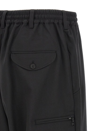 Casual Pants by Y-3 for men in polyester & wool black presents a tailored silhouette, showcasing a tailored wide and long cut with a refined for a truly tailored aesthetic.