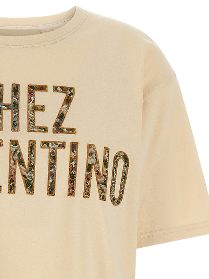 T-Shirt by Valentino Garavani for women in cotton beige, patterned & jacquard showcases a fashionable silhouette, elegantly detailed with a fashionable and crew neckline for a sophisticated, high-fashion look.