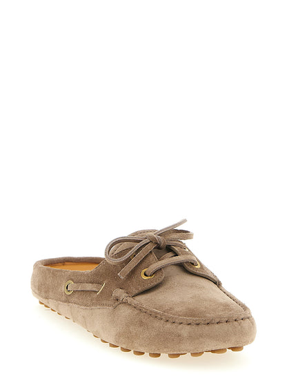 Boat Flat Shoes by Tod's for women in suede calfskin leather beige showcases a resplendent Women's Suede Calfskin Leather Boat Flat Shoes aesthetic with a and .