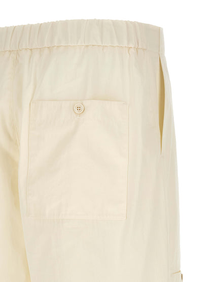 Cargo Pants by Jil Sander for men in cotton beige features an tailored wide with a mid rise and long, creating a tailored utilitarian silhouette.