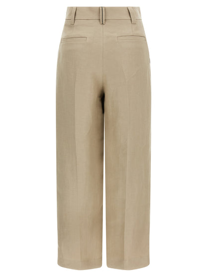 Trousers by Brunello Cucinelli for women in linen beige & signature features an sartorial silhouette, showcasing a precise wide and long with a sartorial for a refined look.