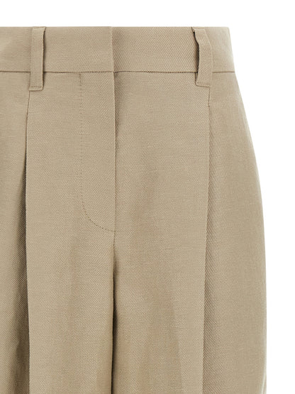 Trousers by Brunello Cucinelli for women in linen beige & signature features a tailored silhouette with a tailored wide, defined by its long and a sophisticated .