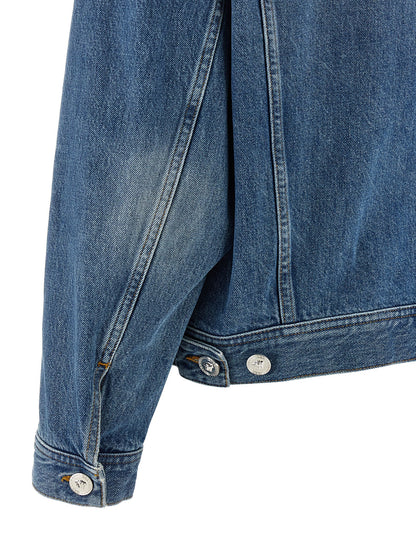 Trucker Jacket by Versace for women in denim cotton & suede leather blue presents a effortlessly chic silhouette, showcasing a sophisticated and premium for a truly effortlessly chic finish.