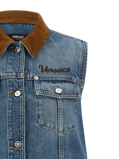 Dress by Versace for women in denim cotton & suede leather blue & signature features an sultry silhouette defined by a and , falling to an sultry short mini for a sultry look.