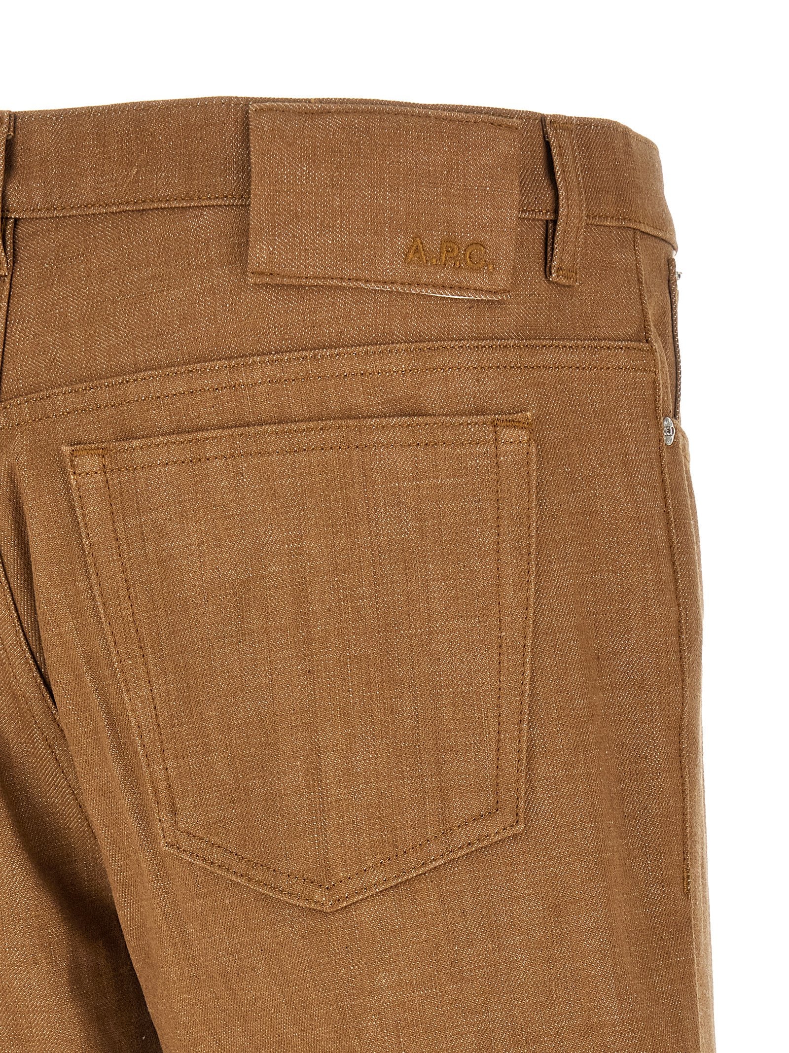 Jeans by A.P.C. for men in denim cotton brown features a polished silhouette with a polished straight-leg & wide, reaching a polished long and finished with a polished .
