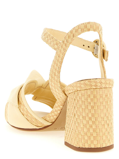 Platform Ankle Strap Sandals by Alexandre Birman for women in raffia & bos taurus cowhide leather and bicolour, natural & yellow presents a captivating silhouette, showcasing the signature style of the Women's Raffia & Bos Taurus Cowhide Leather Platform Ankle Strap Sandals with a captivating platform and captivating .