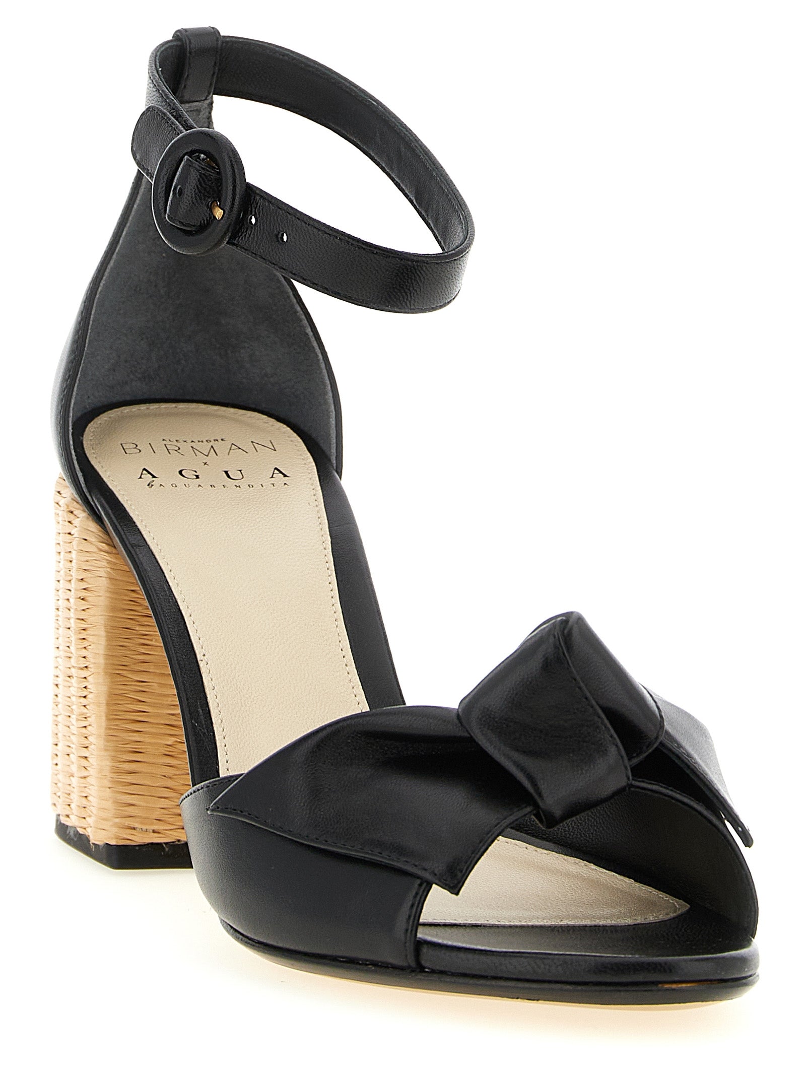 Stiletto Ankle Strap Sandals by Alexandre Birman for women in raffia & bos taurus cowhide leather black features an exquisite silhouette, showcasing the exquisite Women's Raffia & Bos Taurus Cowhide Leather Stiletto Ankle Strap Sandals with a stiletto and .