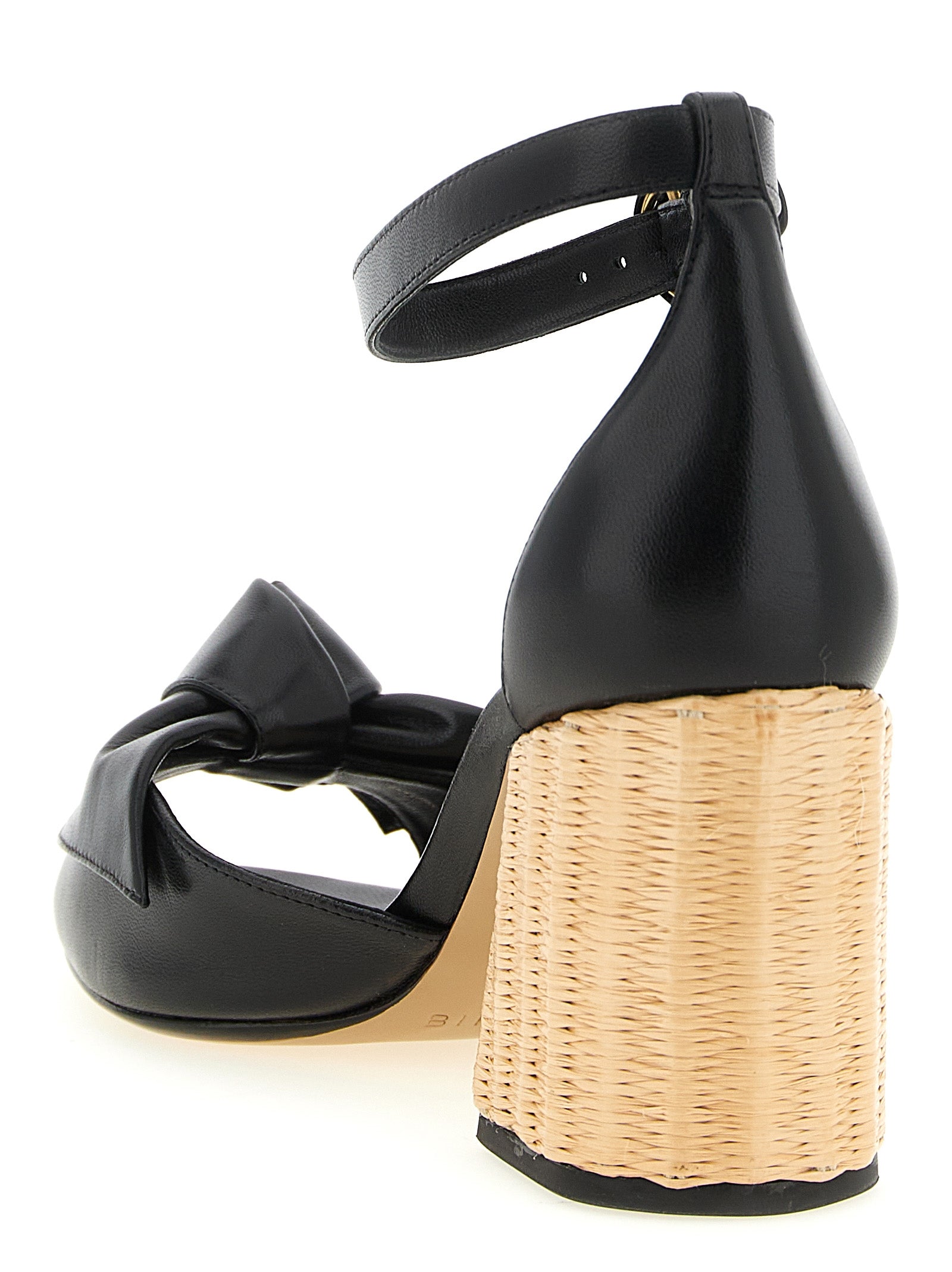 Stiletto Ankle Strap Sandals by Alexandre Birman for women in raffia & bos taurus cowhide leather black features an effortlessly chic silhouette from the Women's Raffia & Bos Taurus Cowhide Leather Stiletto Ankle Strap Sandals collection, showcasing a effortlessly chic stiletto and elegant .