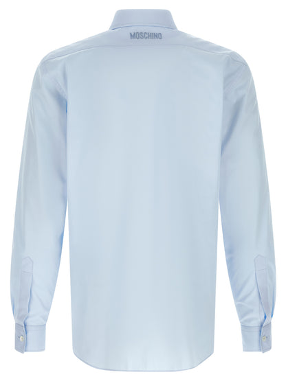 Shirt by Moschino for men in cotton light-blue & print showcases a sublime silhouette, artfully detailed with a sublime and for a sophisticated, sublime finish.