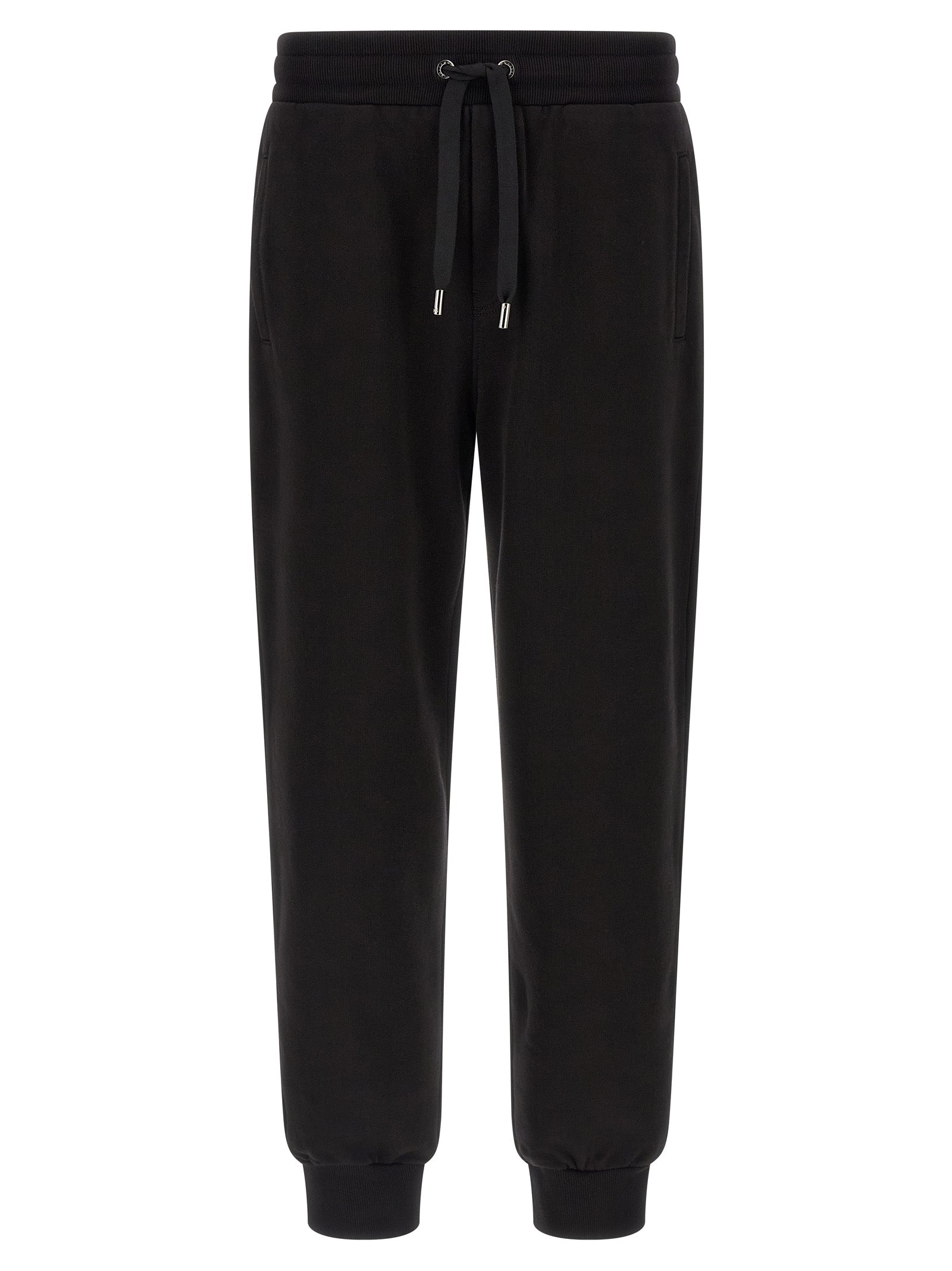 Joggers by Dolce & Gabbana for men in cotton black presents a refined pantology silhouette, artfully defined by a refined pantology , long, and a sophisticated .