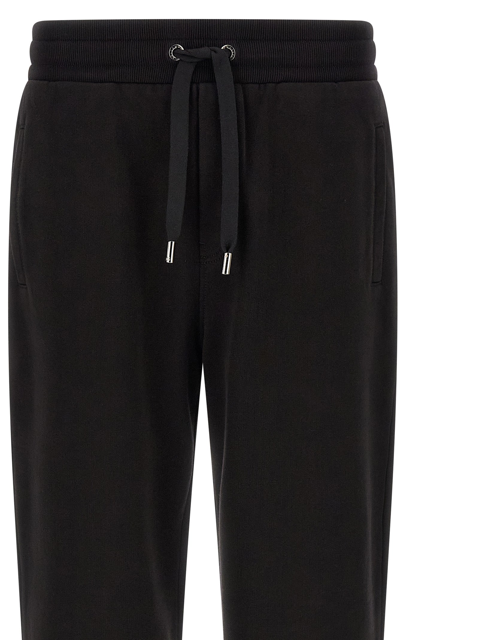 Joggers by Dolce & Gabbana for men in cotton black features a refined silhouette with a refined , defined by a and a refined long for a refined finish.