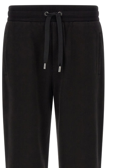 Joggers by Dolce & Gabbana for men in cotton black features a refined silhouette with a refined , defined by a and a refined long for a refined finish.