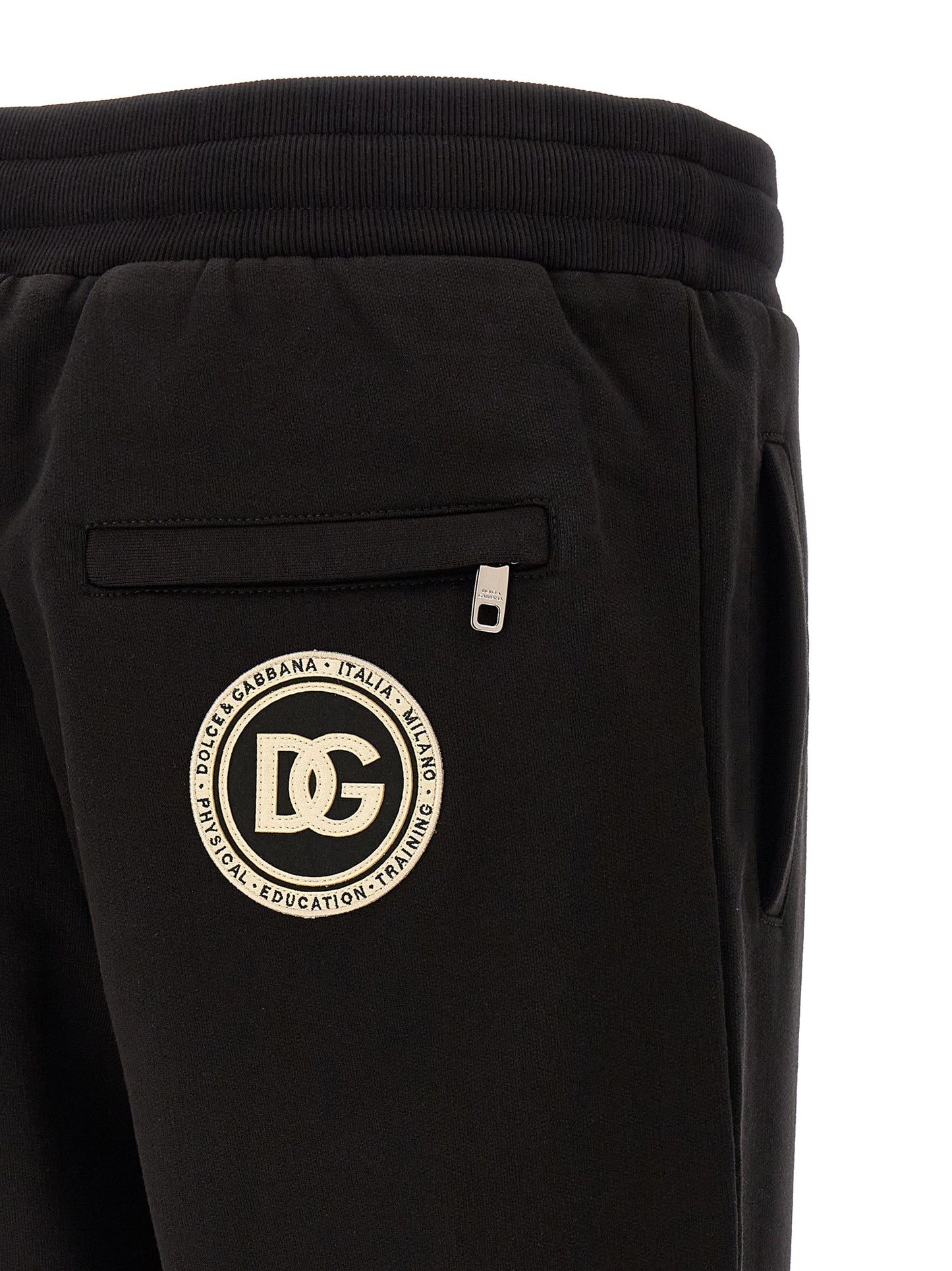 Joggers by Dolce & Gabbana for men in cotton black presents a tailored silhouette, showcasing a tailored and long cut with a refined for a truly tailored aesthetic.