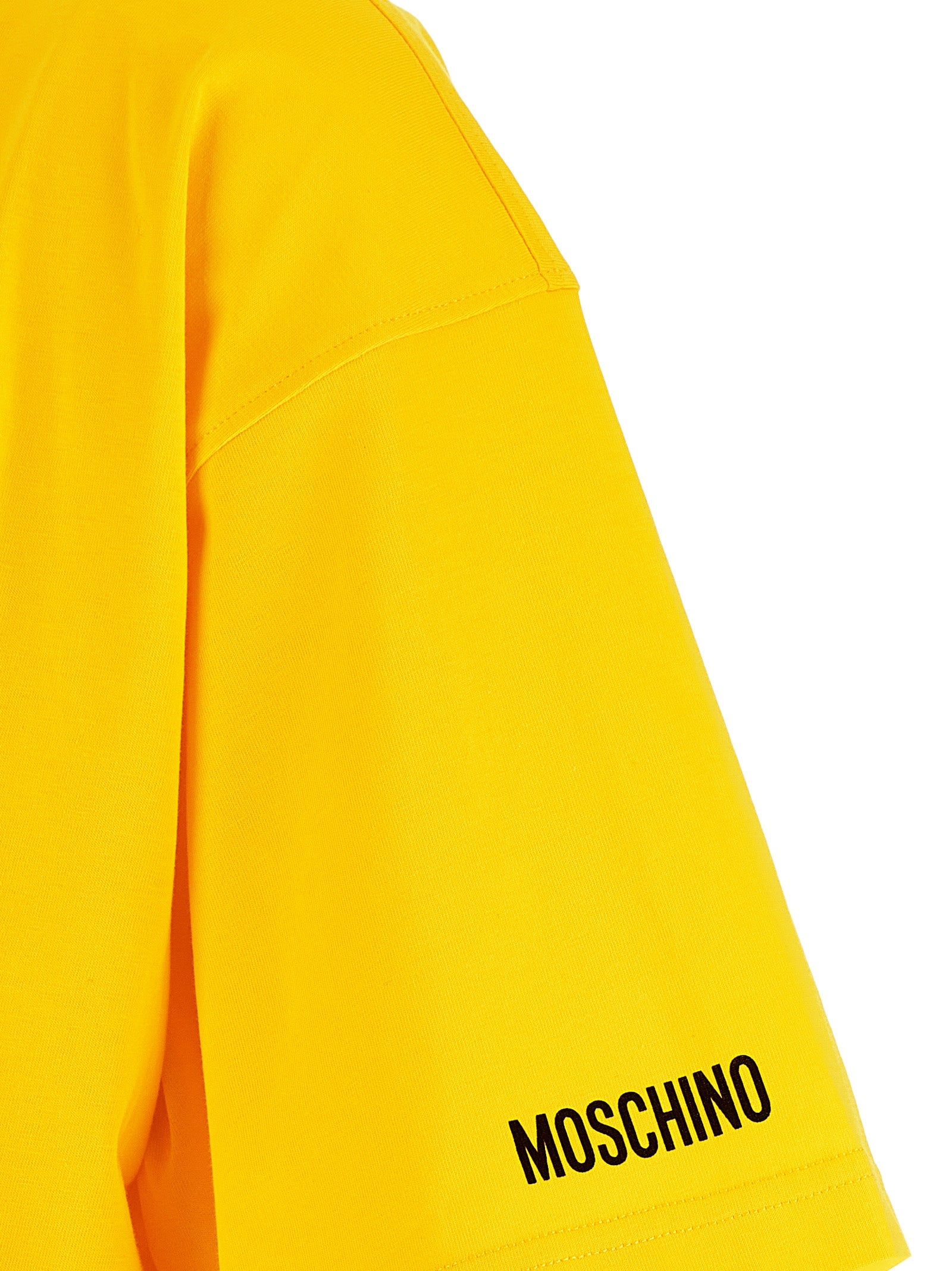 T-Shirt by Moschino for women in organic cotton bicolour, yellow, signature & print features an edgy silhouette, meticulously detailed with a sophisticated and for a truly edgy finish.
