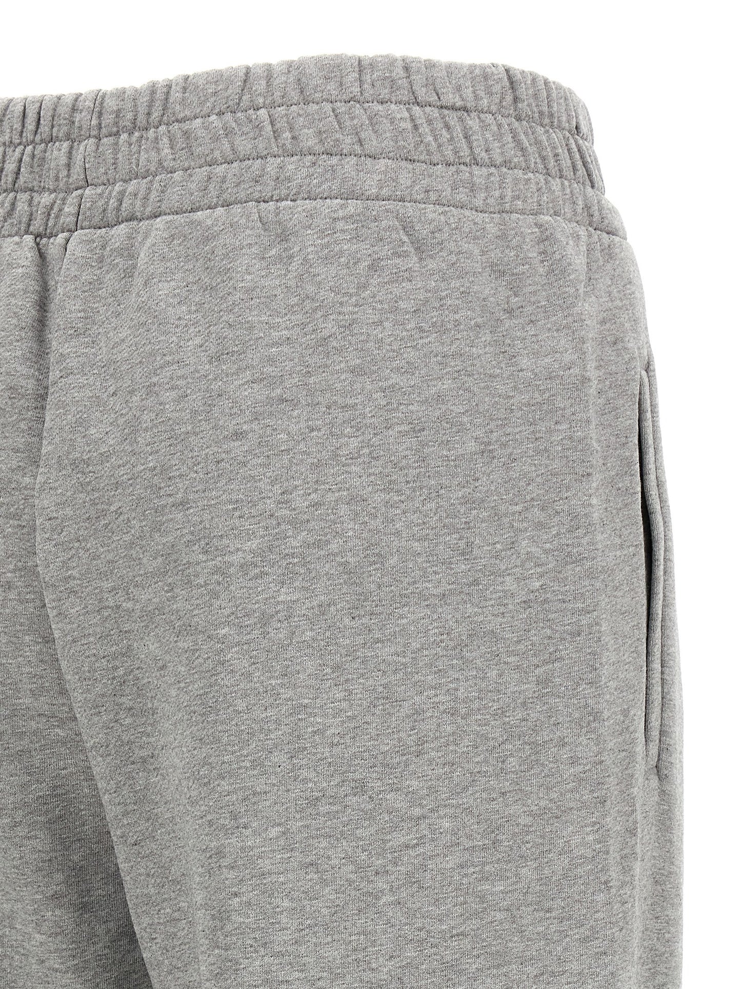 Joggers by Off-White for women in cotton gray & white features an sophisticated and with a precise long, creating a sophisticated and sophisticated silhouette.