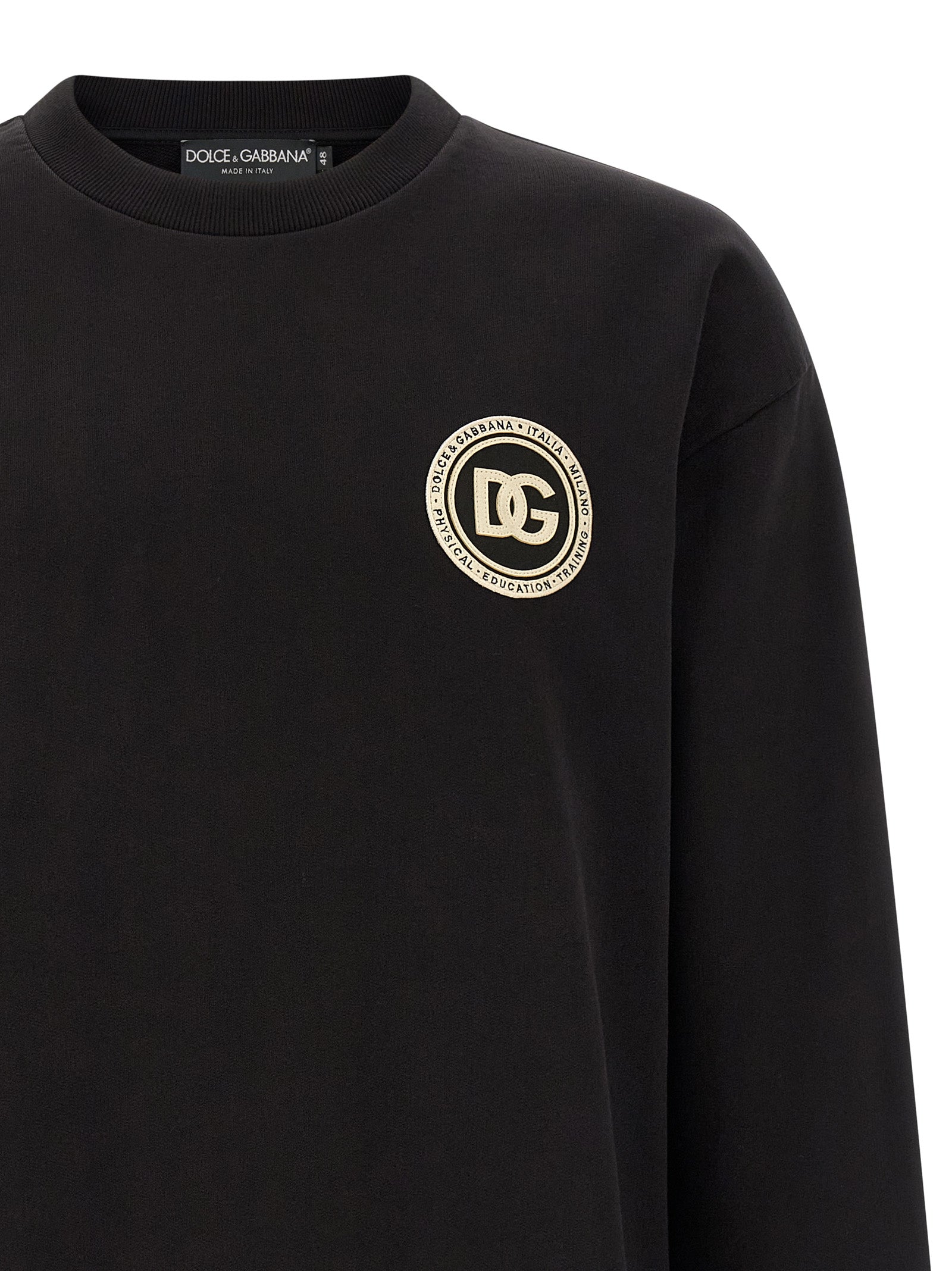 Sweatshirt by Dolce & Gabbana for men in cotton black features an provocated silhouette, detailed with a provocated and a refined crew neckline for a sophisticated aesthetic.