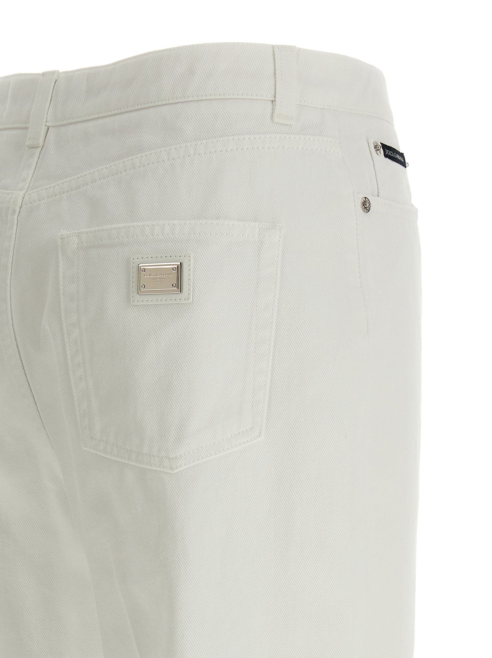 Jeans by Dolce & Gabbana for women in denim cotton white presents a refined pantology silhouette, artfully defined by a refined pantology flared, regular-fit & wide, long, and a sophisticated .