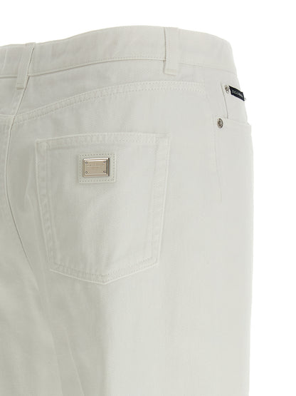 Jeans by Dolce & Gabbana for women in denim cotton white presents a refined pantology silhouette, artfully defined by a refined pantology flared, regular-fit & wide, long, and a sophisticated .